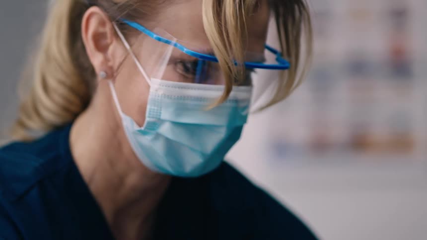 Nurse administers vaccine to black woman