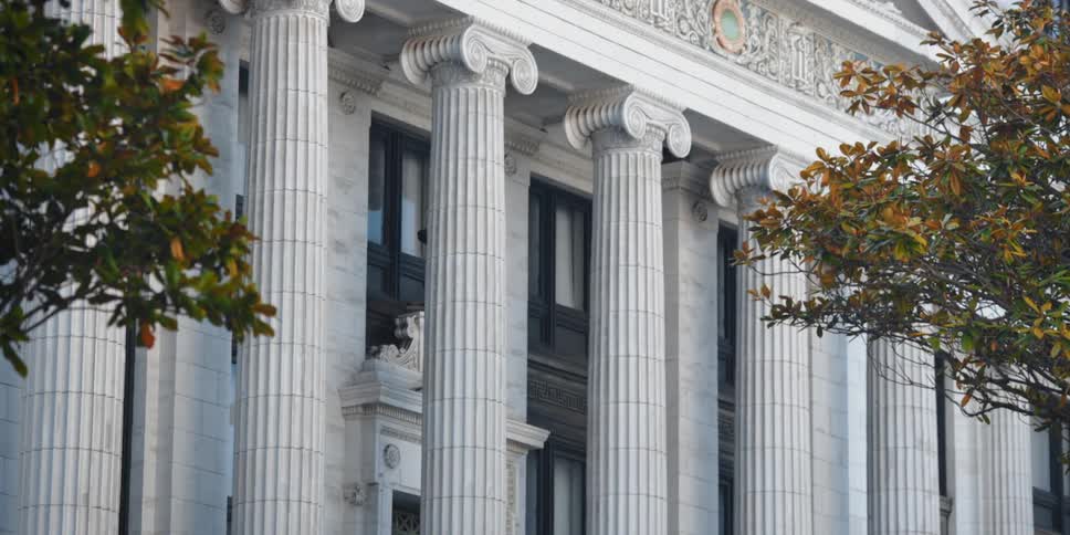 A stone government building with pillars