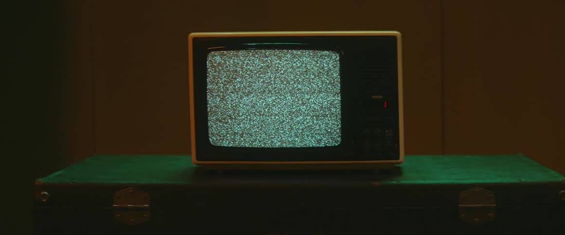 The old television has static on the screen