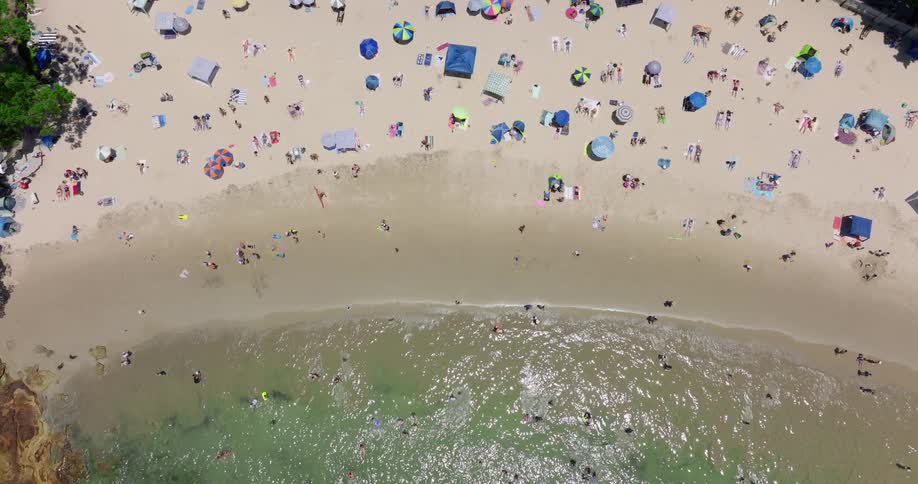 The beach is full of people below