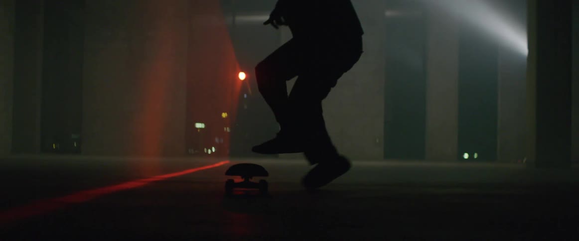 A man does a kickflip on the skateboard