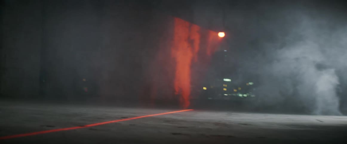 A man races his skateboard on the concrete
