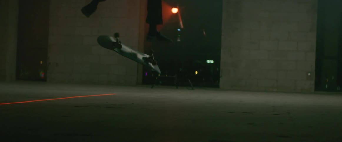 A man does a jump on his skateboard