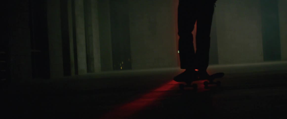 Man skating around in an empty room