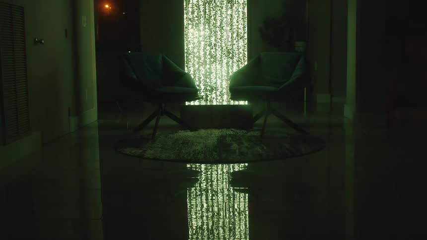 The light flashes different colors behind the chairs