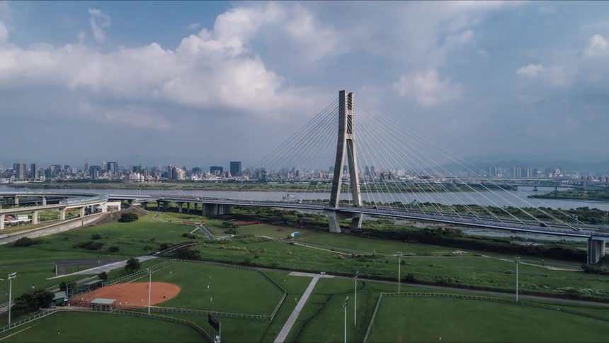 Baseball fields sit near a freeway next to a river that runs past downtown