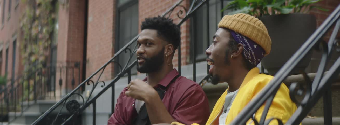 Two friends are talking to each other outdoors in spring