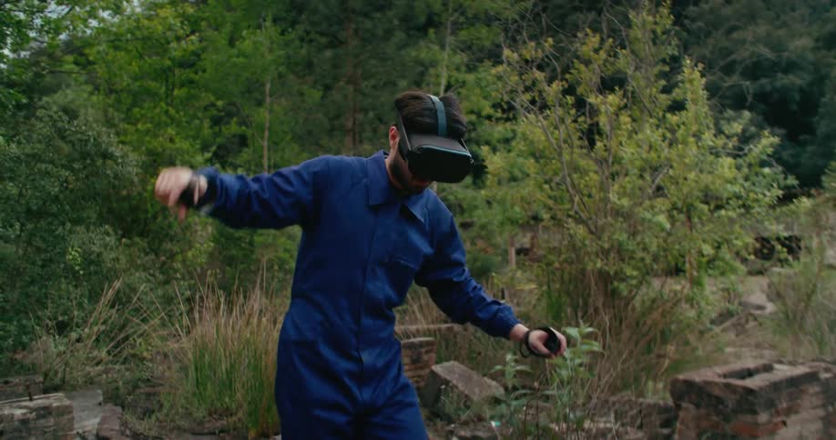 A man hiking outdoors with a virtual reality headset on