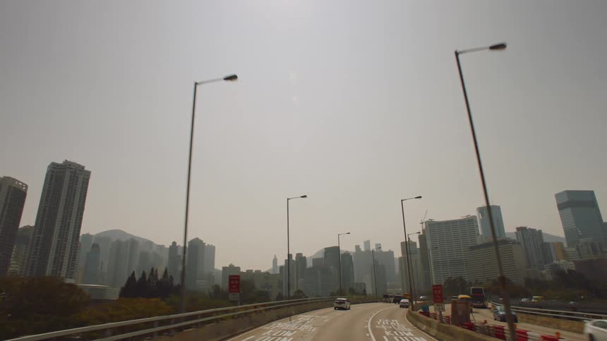 Cars travel on the highway through the city