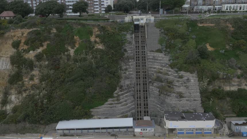Aerial view of a structure built on the slope near the city