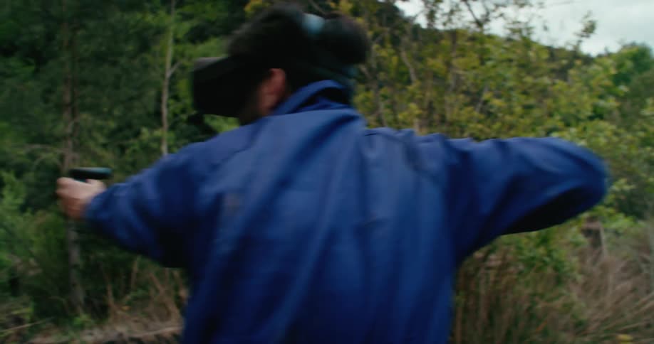 A man is using virtual reality outside
