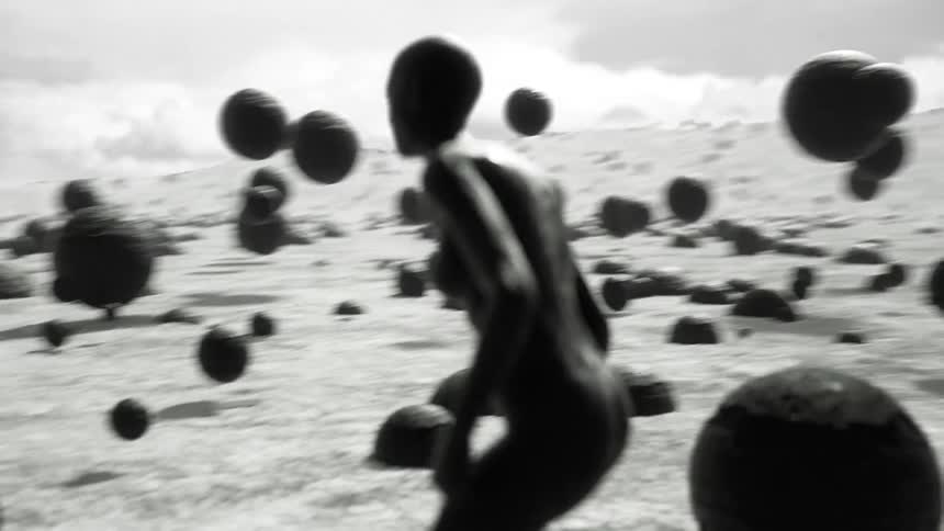 Computer generated graphics of a female figures with large balls floating up in to the air