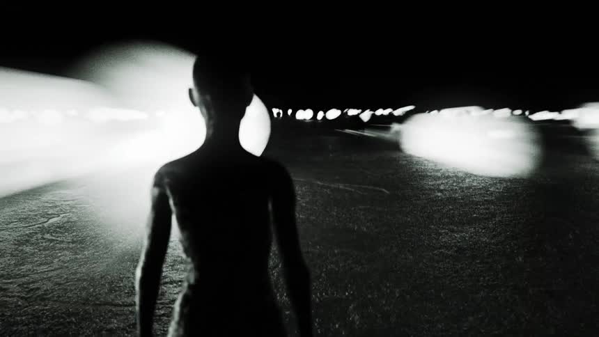 Animated computer graphics of a human silhouette looking bright spheres shoot up to the sky