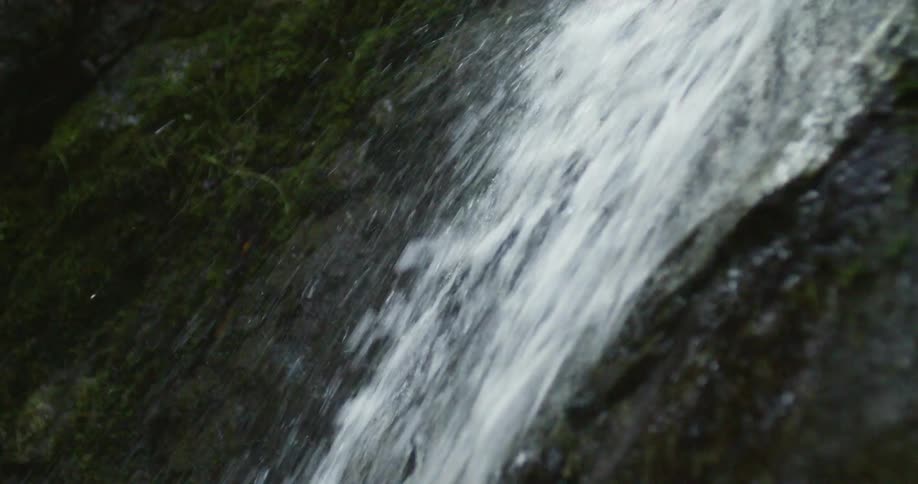 Waterfall rolling over the rocks on the forest