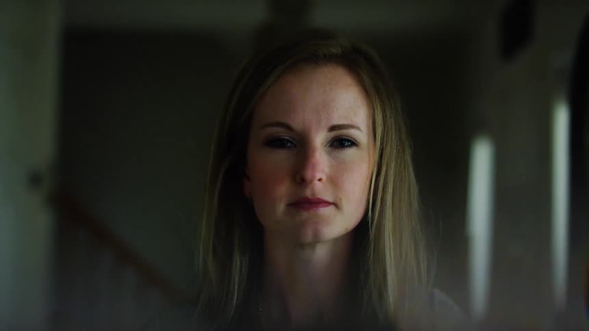 A portrait of a woman in a room