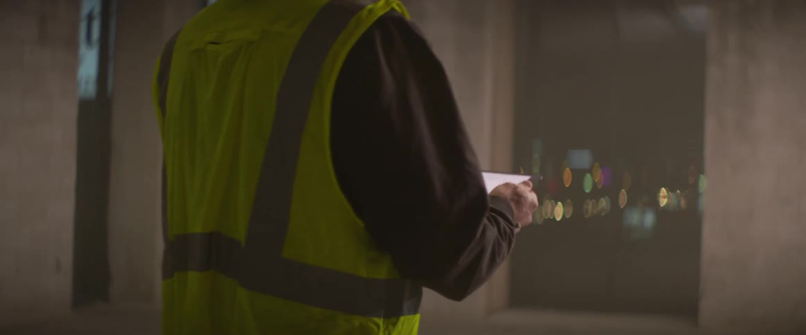 A construction worker checks the inside of the building