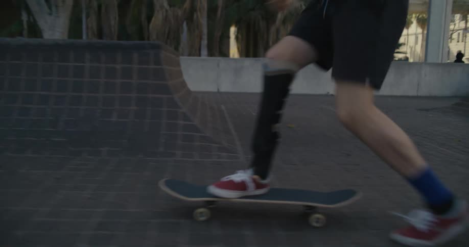A man is jumping on his skateboard