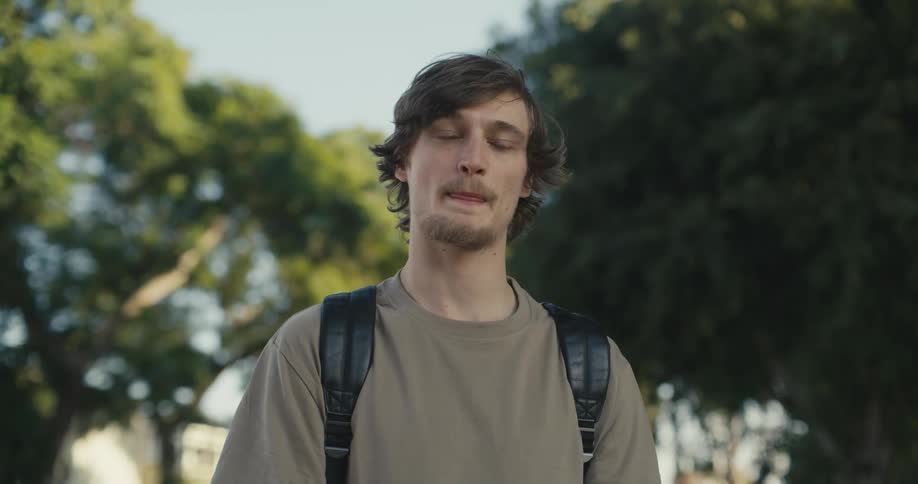 A man looks around outside