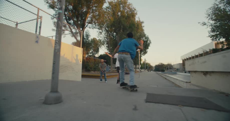 A group of people skateboarding outdoors