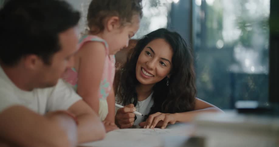 A mother father and daughter coloring