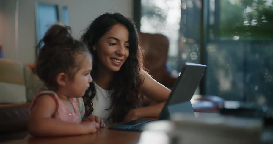 A mother and daughter using a tablet computer