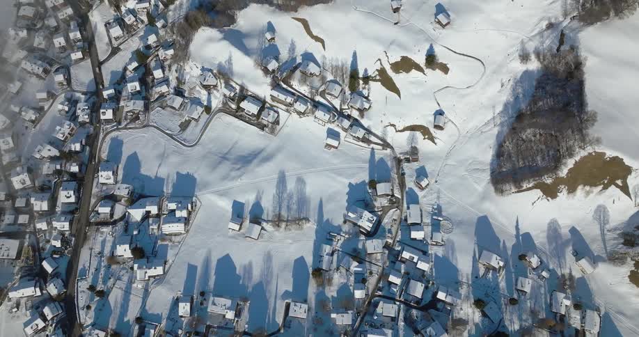 A snow covered village on a mountain slope