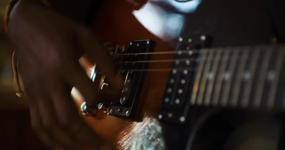 A man plays the guitar