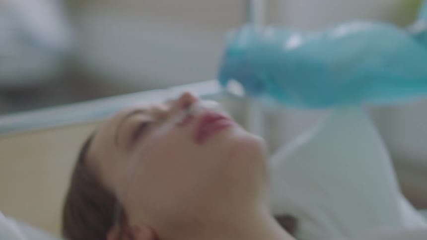 A patient in a hospital bed is pushed