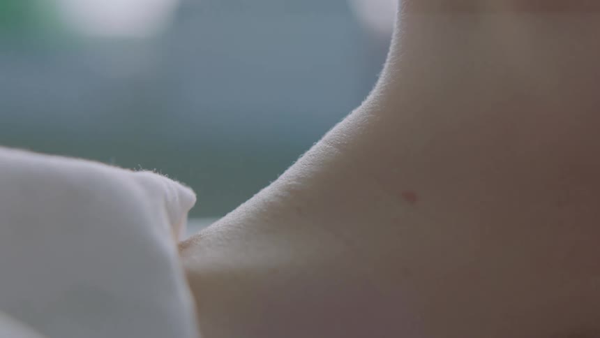A person is swallowing