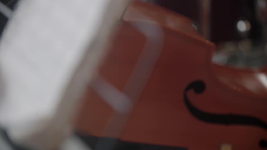 A musical instrument sits beside a music stand