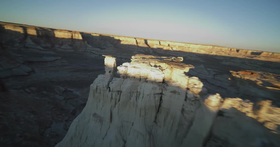 An aerial view flying out over a canyon