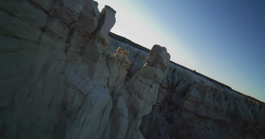 Formations protrude out of the deep desert canyon