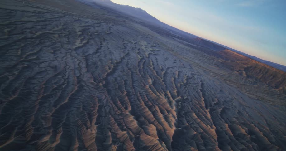 The sun is rising on the canyon