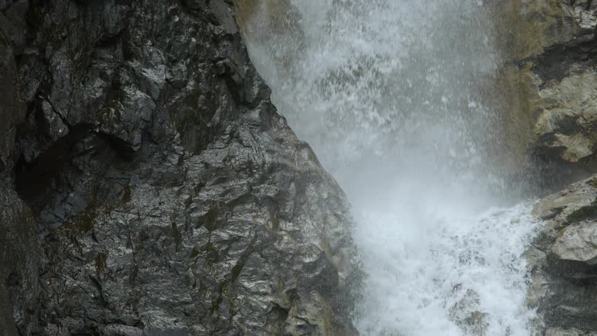 Waterfall cascades down the cliffside
