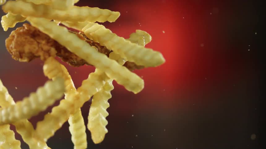 Fries and chicken are crashing together on display