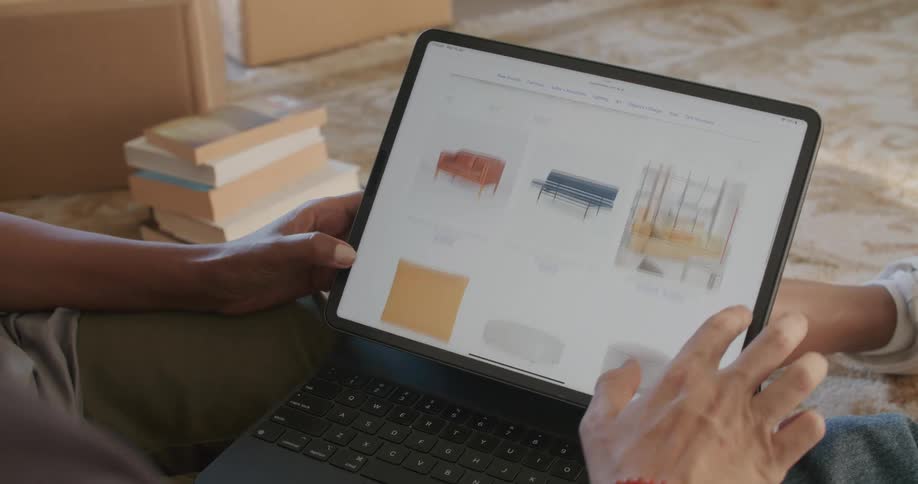 Two people are shopping on the laptop