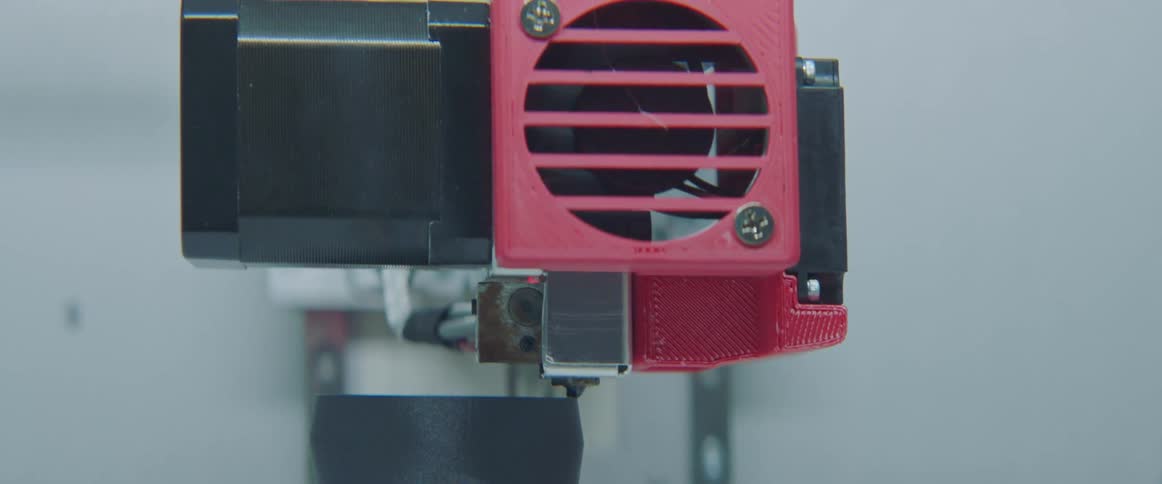 A 3d printer is making a cup