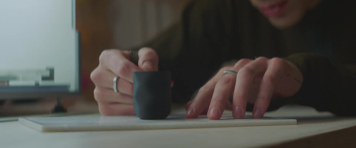 A view of a person carving on a table