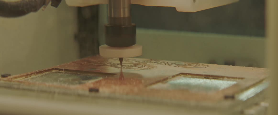 A machine cuts material and then the blade lifts up
