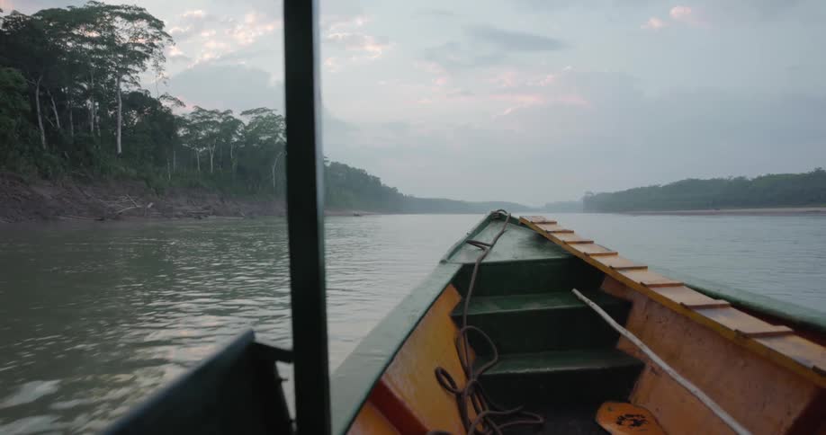 A boat is moving on the body of water