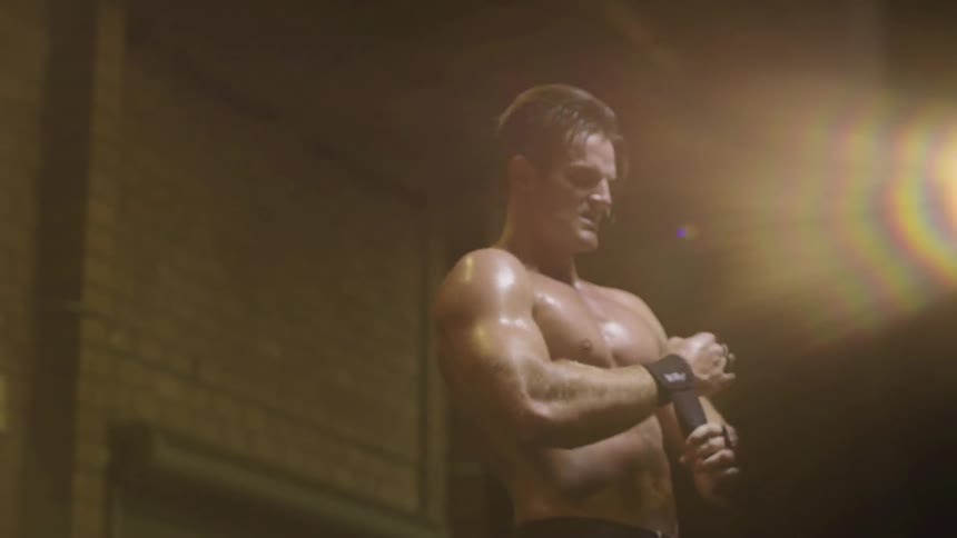 A man is sweating as he works out