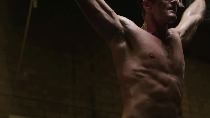 Man lifts heavy weight bar above head several times