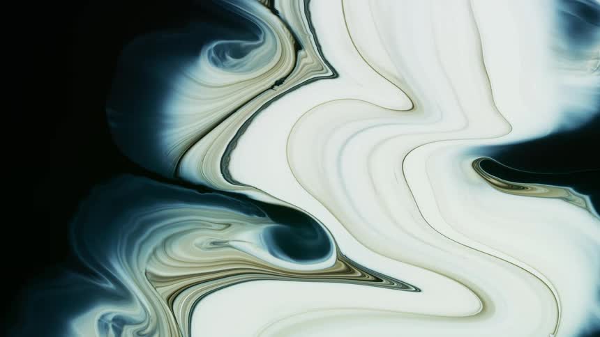 Abstract footage of marbling colors spreading across the screen