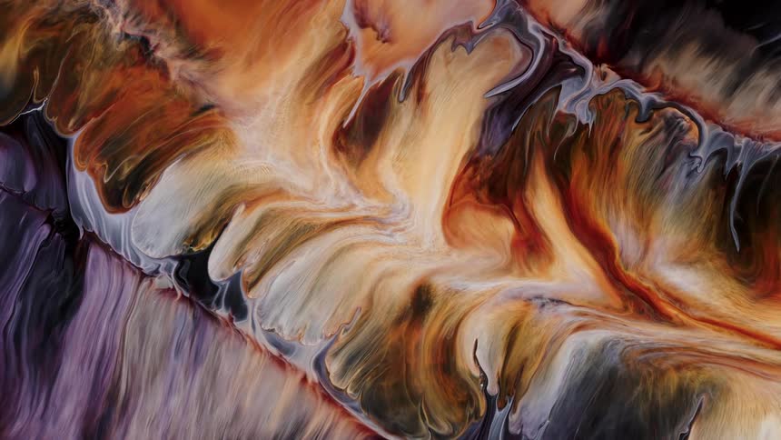 Liquid dyes and paints swirl and burst then expand and flow