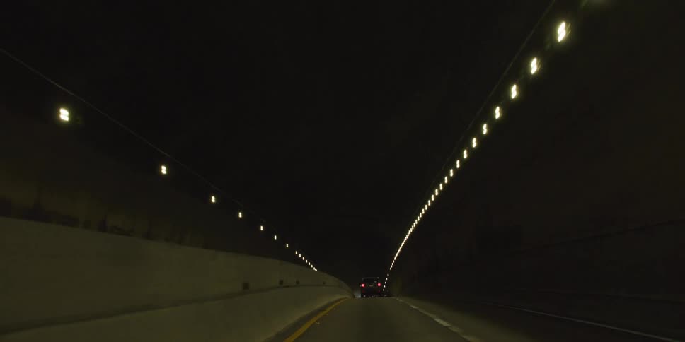 Vehicle drives through long tunnel