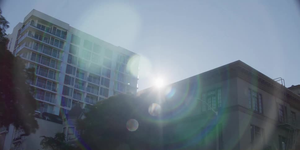 Buildings are shown in a downtown city in spring