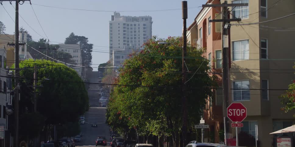 Traffic flows along hilly streets in san francisco neighborhood