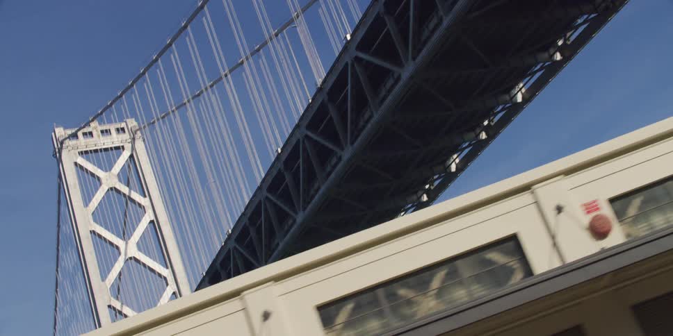 A large bridge is above the building