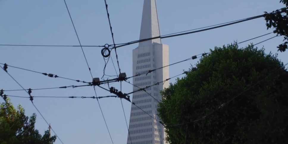 A tower with a steeple in a city