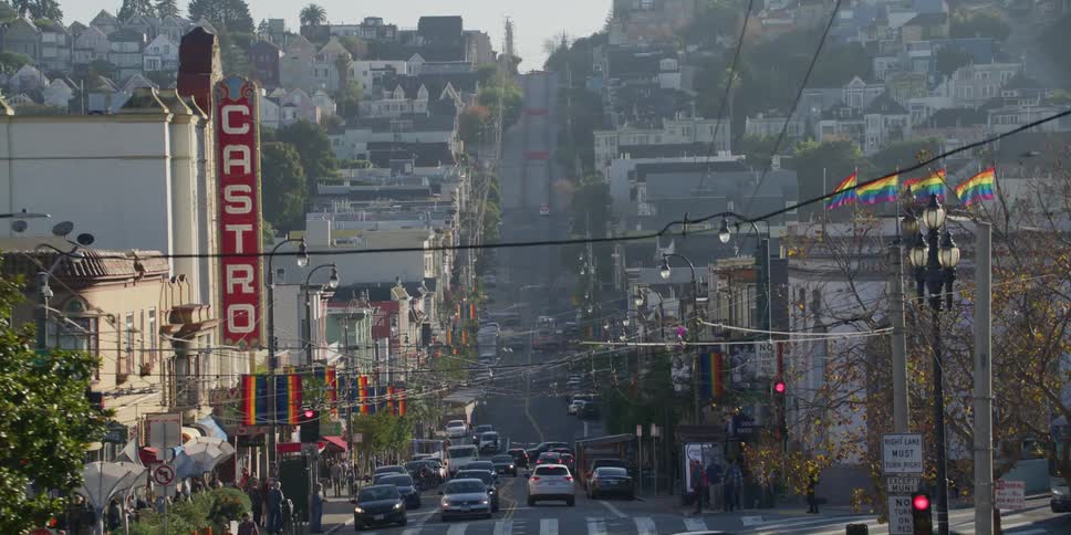Vehicles driving down the road on the city of san francisco at morning